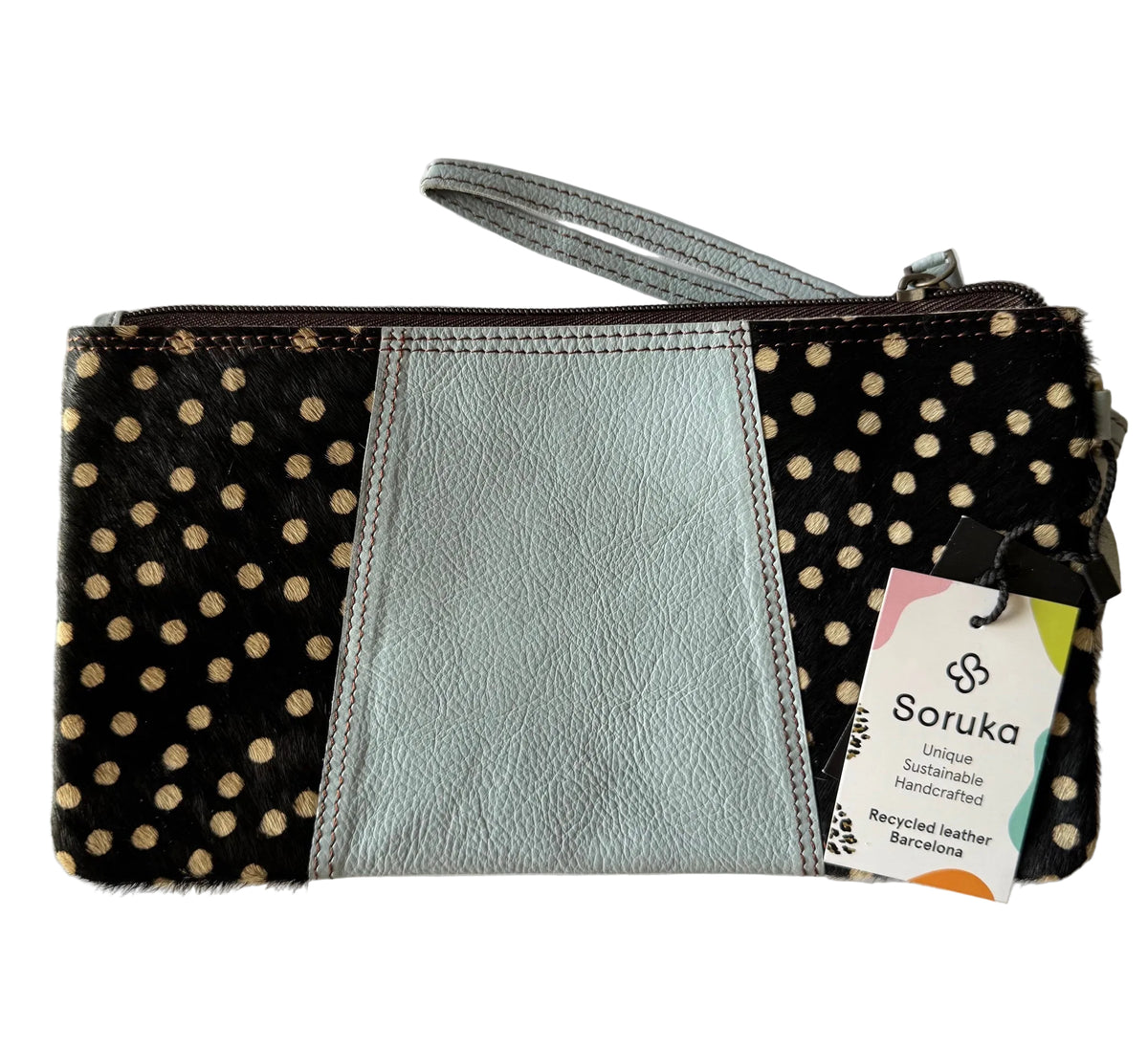 reverse side of soruka clutch in soft blue & spot animal print