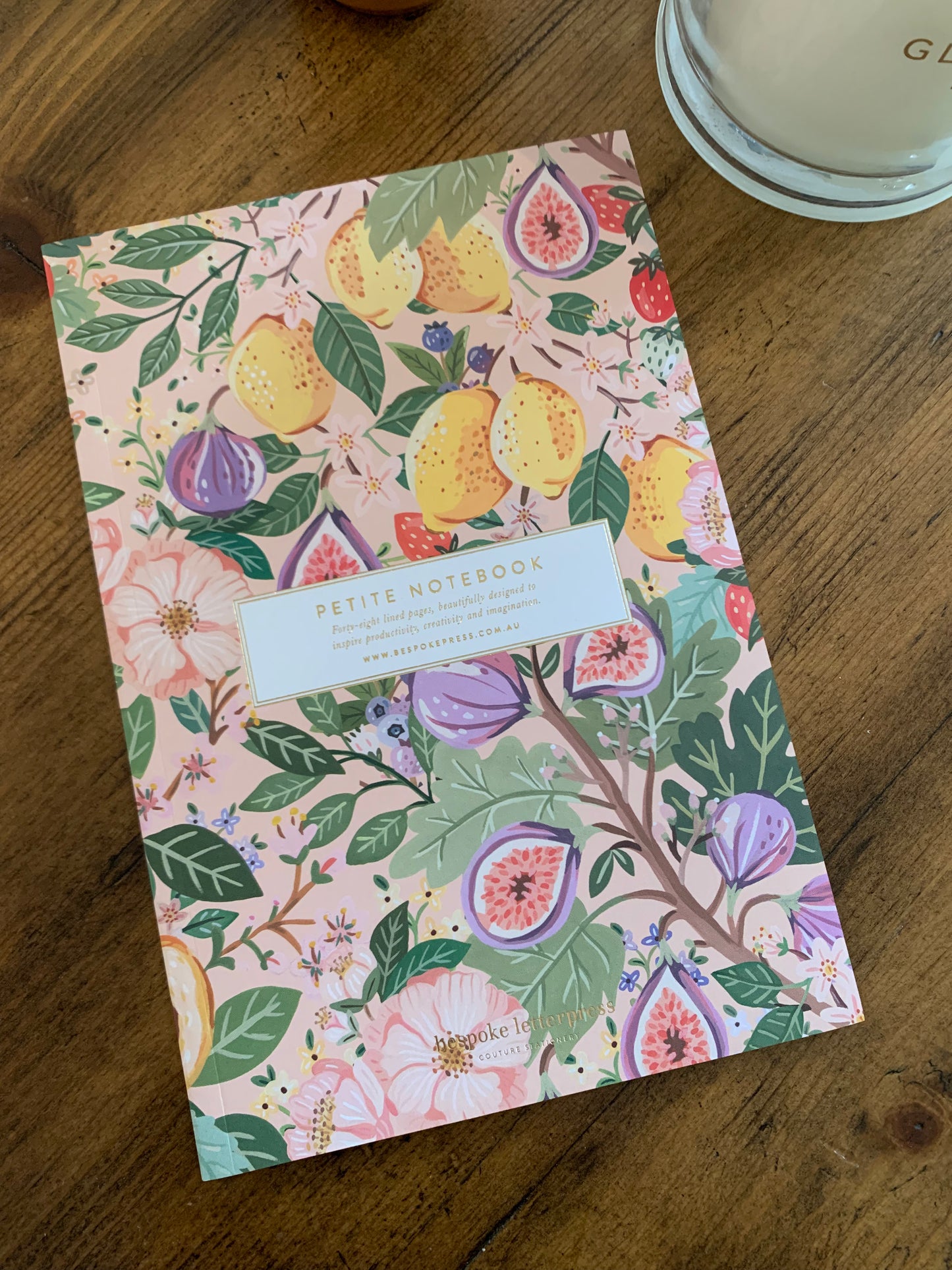 petite notebook summer fruit lemons figs berries on pink floral background