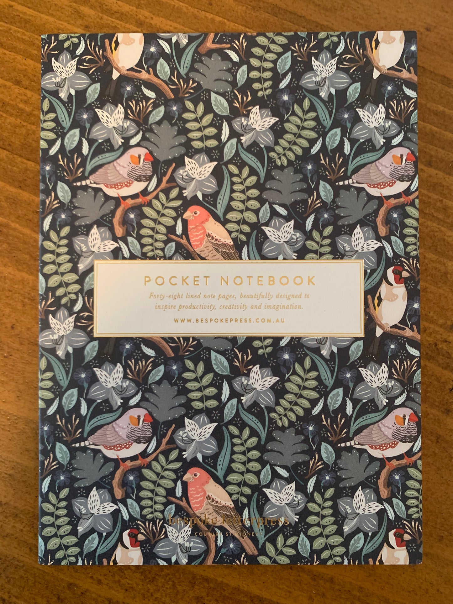 lined pocket notebook finches 48 page grey green orange tones on navy floral background