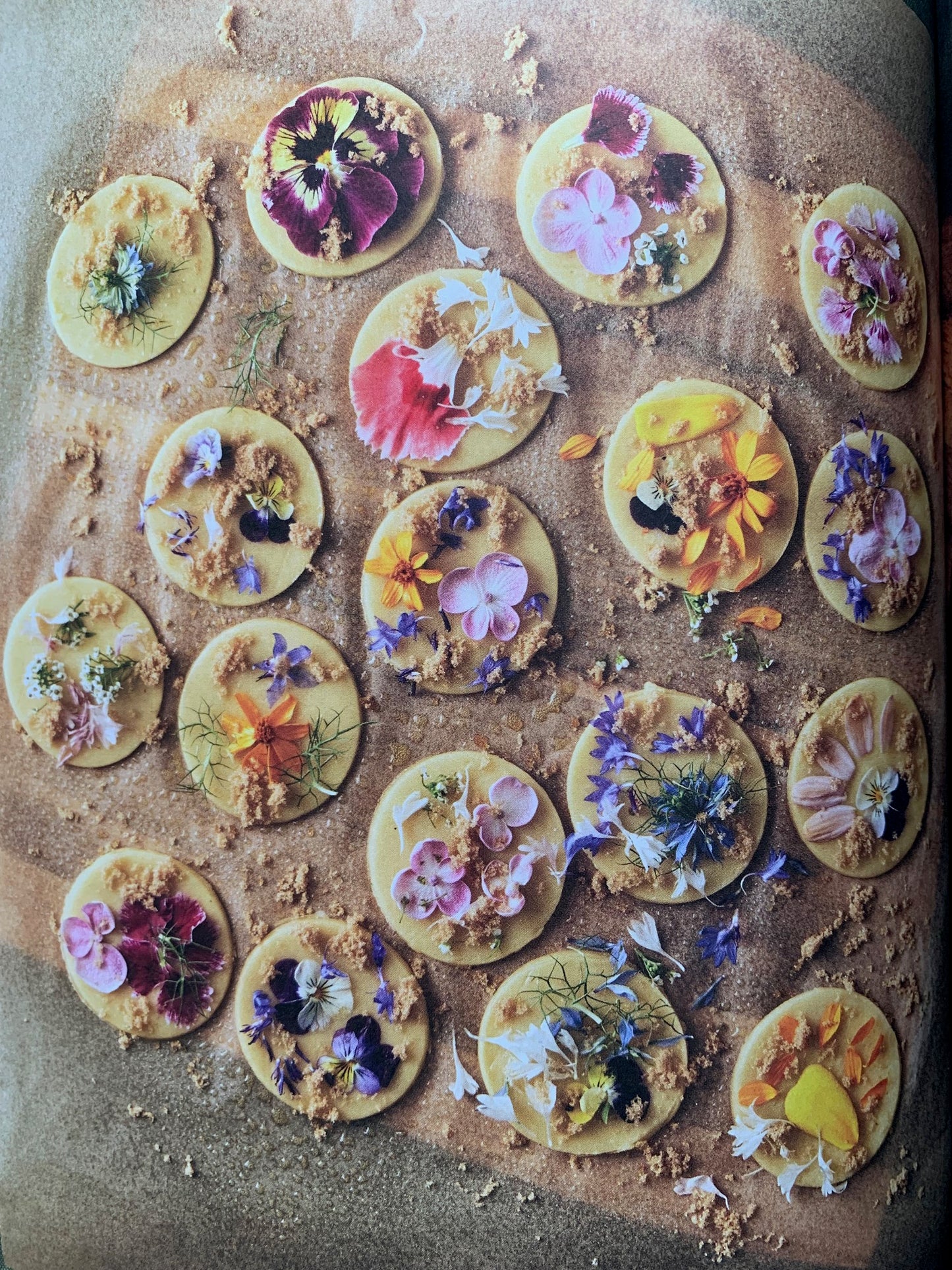 Edible flower cookies with pansys, violas & dianthus sprinkled with brown sugar.